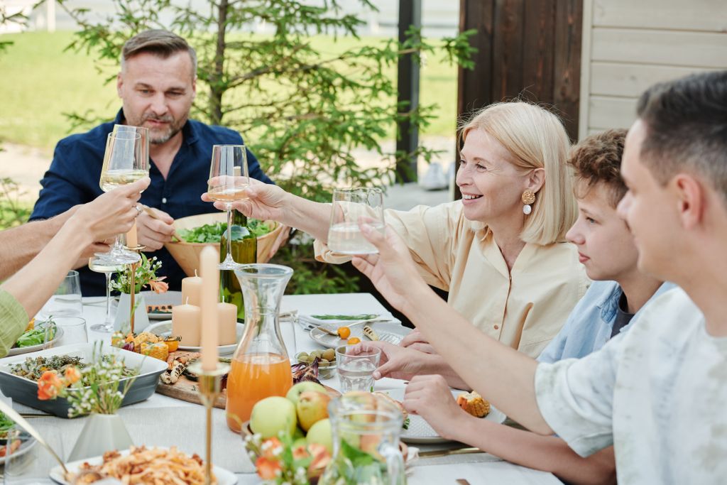 Family enjoying relaxed meal while practising intuitive eating and body trust.