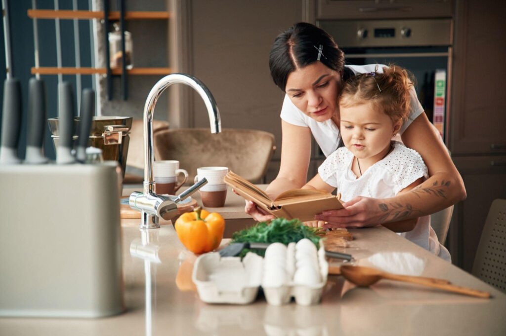 mother and daughter reading nutrition articles together
